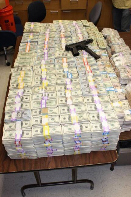Police recovered at least $24 million, as well as a Tec-9 pistol.